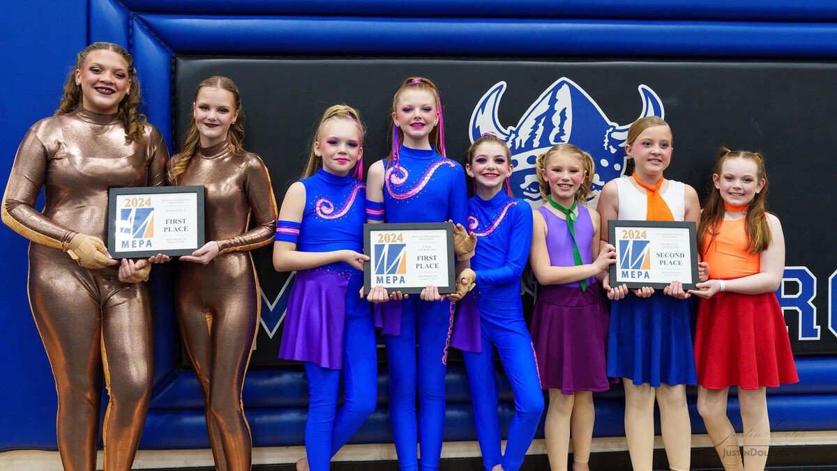 Eight students holding three certificates